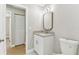 Well-lit bathroom featuring a granite countertop vanity and decorative mirror at 9936 62Nd N St, Pinellas Park, FL 33782
