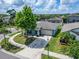 An aerial view of a single-story home with a two-car garage in a neighborhood at 10119 Rose Petal Pl, Riverview, FL 33578