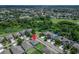 This aerial view captures the property's location amongst lush greenery and nearby lakes at 10119 Rose Petal Pl, Riverview, FL 33578