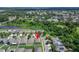 This aerial view of the property shows the surrounding community with ponds and other landscaping features at 10119 Rose Petal Pl, Riverview, FL 33578