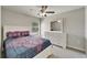 Bright bedroom with a large window and a white dresser at 10119 Rose Petal Pl, Riverview, FL 33578