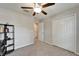Bedroom with ceiling fan and adjacent closets at 10119 Rose Petal Pl, Riverview, FL 33578