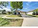 Charming single-story home with well-manicured lawn and a two-car garage at 10119 Rose Petal Pl, Riverview, FL 33578