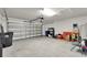 This garage is spacious and has an automatic door, providing ample room for parking and storage at 10119 Rose Petal Pl, Riverview, FL 33578