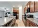 A well-lit kitchen with stainless steel appliances and granite countertops at 10119 Rose Petal Pl, Riverview, FL 33578