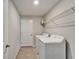 This laundry room features a washer and dryer, as well as a wire shelf for storage at 10119 Rose Petal Pl, Riverview, FL 33578