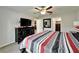 Spacious main bedroom featuring a ceiling fan and ample closet space at 10119 Rose Petal Pl, Riverview, FL 33578