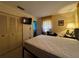 Neutral bedroom with closet, TV, and window for natural light at 1106 Trellis Ave, Spring Hill, FL 34606