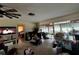 Comfortable living room with ceiling fan, view to bedroom and enclosed, attached patio at 1106 Trellis Ave, Spring Hill, FL 34606