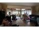 Comfortable living room showing attached, enclosed patio and lots of natural light at 1106 Trellis Ave, Spring Hill, FL 34606