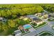 This aerial showcases a community pool with lounge chairs and houses at 11597 Weaver Hollow Rd, New Port Richey, FL 34654