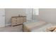 Serene bedroom with a light-colored dresser, a bed, and a comfortable atmosphere at 11597 Weaver Hollow Rd, New Port Richey, FL 34654