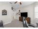 Flex room offering a desk and chair with a big screen TV, perfect for multiple uses at 11597 Weaver Hollow Rd, New Port Richey, FL 34654