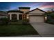 Charming single-Gathering home featuring a well-manicured lawn and attached two-car garage at 11597 Weaver Hollow Rd, New Port Richey, FL 34654