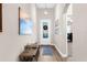 Inviting entryway showcasing a decorative front door, stylish lighting, and elegant decor at 11597 Weaver Hollow Rd, New Port Richey, FL 34654