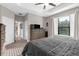Main bedroom features a large bed, walk-in closets, and an ensuite bathroom at 11597 Weaver Hollow Rd, New Port Richey, FL 34654