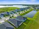 Neighborhood with picturesque lakes, modern homes, and lush green landscaping at 11940 Stone Pine St, Riverview, FL 33569