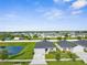 Charming single-Gathering home featuring a pond view, well-manicured lawn, and a two-car garage at 11940 Stone Pine St, Riverview, FL 33569