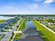 Beautiful aerial view of the neighborhood showcasing the community pond and landscaping at 11940 Stone Pine St, Riverview, FL 33569