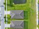 Aerial view of homes showcasing well-maintained lawns and neighborhood layout at 11940 Stone Pine St, Riverview, FL 33569