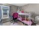 Cozy ' bedroom featuring a bunk bed, desk and chair with abundant natural light at 11940 Stone Pine St, Riverview, FL 33569