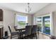 Dining room with table, chairs, and sliding doors to the lanai at 11940 Stone Pine St, Riverview, FL 33569