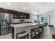 Stylish kitchen boasting stainless steel appliances, breakfast bar seating, and pendant lighting at 11940 Stone Pine St, Riverview, FL 33569