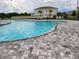 Community pool with brick surround, perfect for hot summer days at 11940 Stone Pine St, Riverview, FL 33569