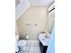 Compact bathroom with a toilet, sink with vanity, and modern lighting fixture at 12249 Country White Cir, Tampa, FL 33635