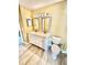 Well-lit bathroom featuring a double vanity with a granite countertop and sleek fixtures, perfect for a contemporary lifestyle at 12249 Country White Cir, Tampa, FL 33635