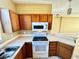 Modern kitchen with an electric stove, built-in microwave, and ample counter space at 12249 Country White Cir, Tampa, FL 33635