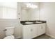 Bathroom with granite countertop, double sink vanity, white cabinets, and a large mirror at 13408 Nimble Minke # 155E, Riverview, FL 33579