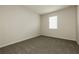 Neutral bedroom featuring a window and plush gray carpeting at 13408 Nimble Minke # 155E, Riverview, FL 33579