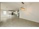 Open-concept space showcasing a modern kitchen with an island and pendant lighting at 13408 Nimble Minke # 155E, Riverview, FL 33579