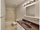 Standard bathroom with a tub, sink, toilet, and a tile floor at 1421 Mohrlake Dr, Brandon, FL 33511