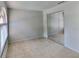 Bedroom with a closet, tile floors, and a large window at 1421 Mohrlake Dr, Brandon, FL 33511