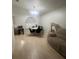 Comfortable dining area with a table and chair set, plus a large window at 1421 Mohrlake Dr, Brandon, FL 33511