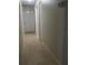 Hallway featuring neutral walls and tile flooring at 1421 Mohrlake Dr, Brandon, FL 33511