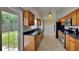 Kitchen with stainless steel appliances, dark countertops, and wood cabinets at 1421 Mohrlake Dr, Brandon, FL 33511