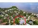 Aerial view showcasing the property's backyard pool, fence and proximity to the nearby bay at 1445 Coburn Dr, Tarpon Springs, FL 34689