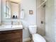 Updated bathroom featuring a modern vanity, stylish shower, and decorative tile accents at 1445 Coburn Dr, Tarpon Springs, FL 34689