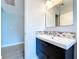 Bathroom featuring a modern vanity, with decorative tile accents at 1445 Coburn Dr, Tarpon Springs, FL 34689