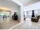Open-concept view of the dining and living room, showcasing the home's airy layout and natural light at 1445 Coburn Dr, Tarpon Springs, FL 34689