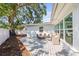 Back deck features outdoor seating and access to backyard at 1518 Cheyenne Ne St, St Petersburg, FL 33703