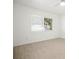 Bright, airy bedroom with light wood flooring and a large window at 1518 Cheyenne Ne St, St Petersburg, FL 33703