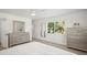 Bright bedroom with modern decor, ceiling fan, and a large window offering a lush view at 1518 Cheyenne Ne St, St Petersburg, FL 33703