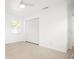 Bright bedroom with wood floors, closet, and natural light from the window at 1518 Cheyenne Ne St, St Petersburg, FL 33703