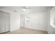 Clean bedroom with white walls, a closet, and wood-look flooring at 1518 Cheyenne Ne St, St Petersburg, FL 33703