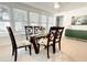 Bright dining room with seating for six and a view into living area at 1518 Cheyenne Ne St, St Petersburg, FL 33703