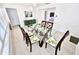 Bright dining room with seating for six and a view into living area at 1518 Cheyenne Ne St, St Petersburg, FL 33703